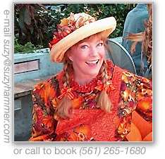 Pumpkin Patty sitting beside a palm tree.